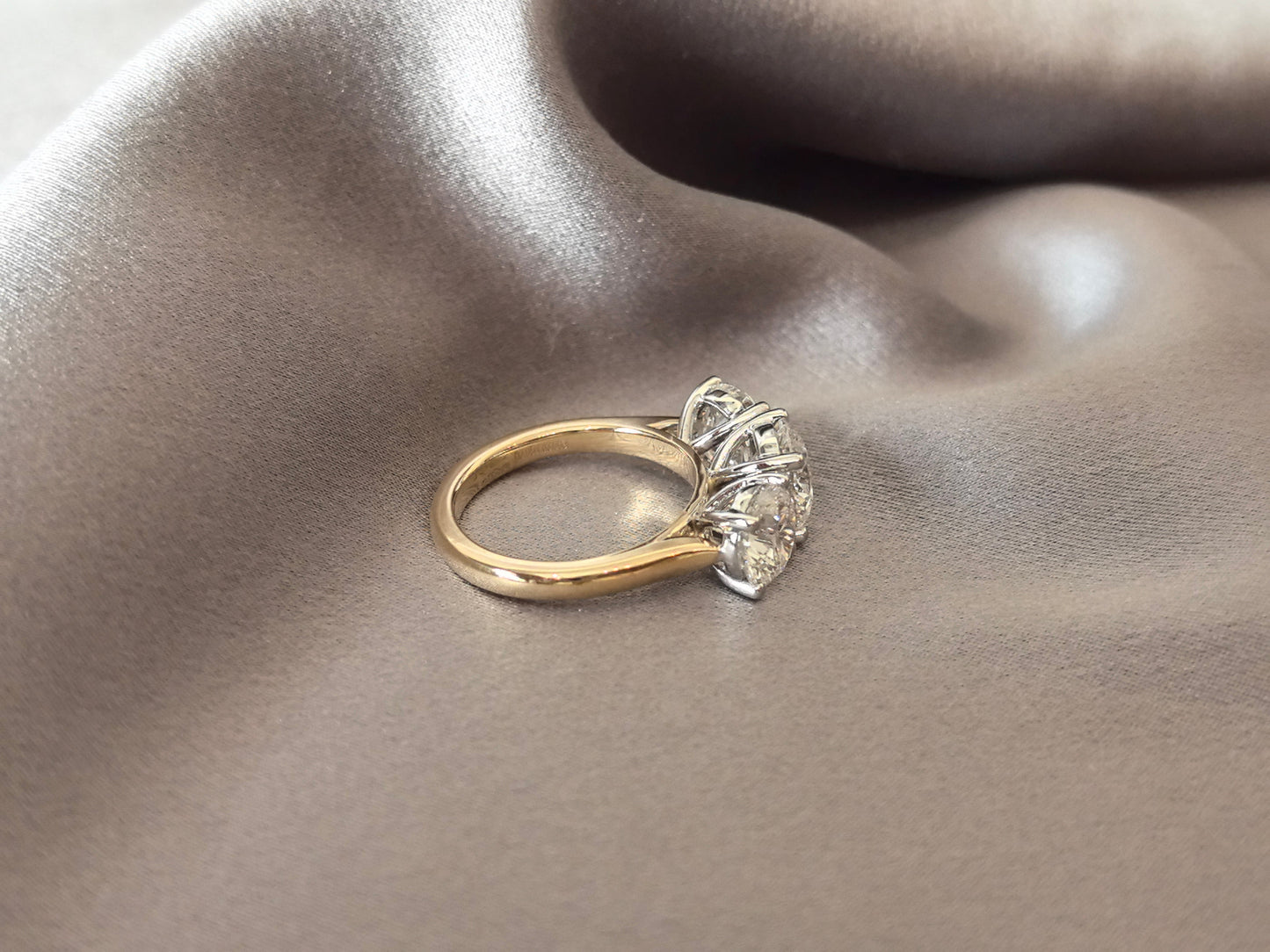 Round-Cut Lab-Grown Diamond Three-Stone Engagement Ring - Prong-Set - Striking Two-Tone Gold Color Contrast