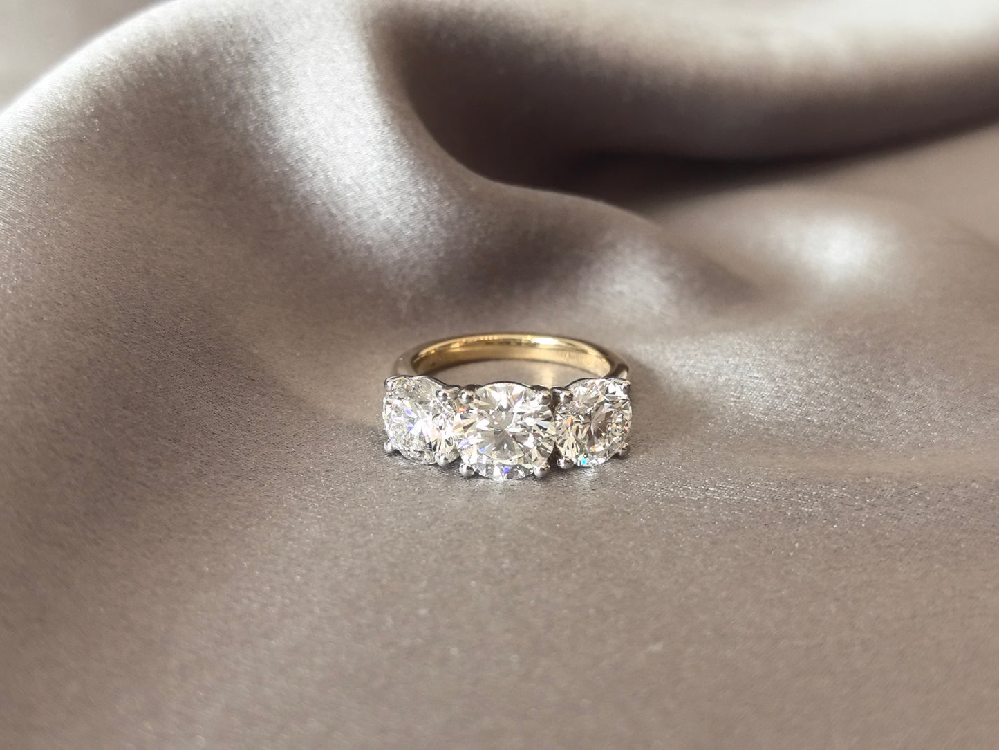 Round-Cut Lab-Grown Diamond Three-Stone Engagement Ring - Prong-Set - Striking Two-Tone Gold Color Contrast